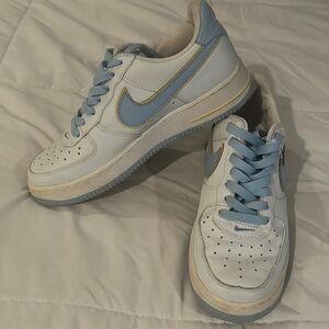 Women’s Nike sneakers. Circa 2004. White with light blue swoosh and yellow.